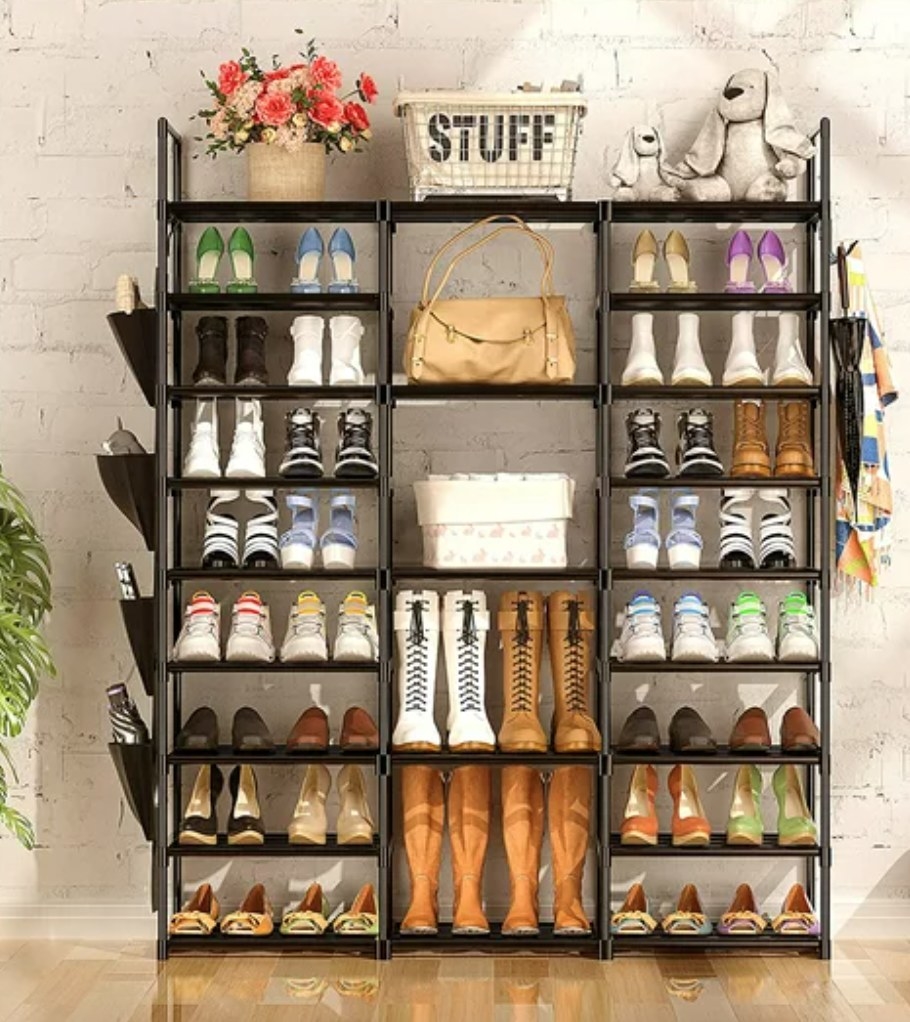 a metal tiered rack with multiple shoes and other accessories displayed
