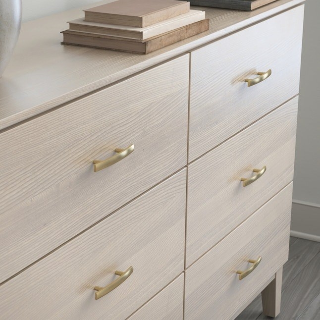 the arched drawer pulls on a dresser