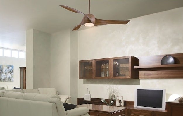 the 3-blade fan with a light hanging in a living room