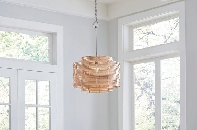 the rattan chandelier hanging in a room