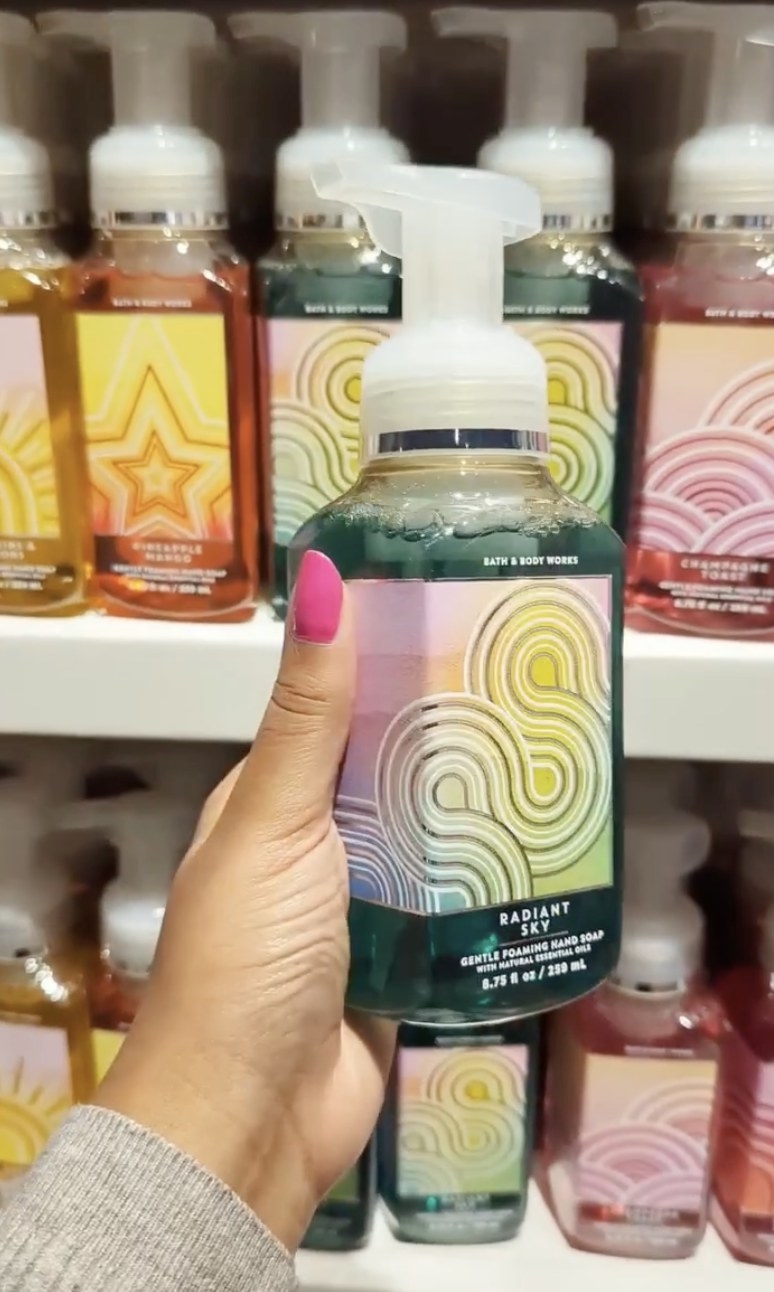 Someone holding the radiant sky hand soap