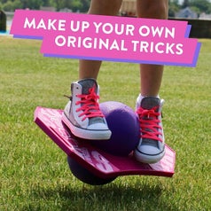 Mode's feet on pink and purple pogo trick ball