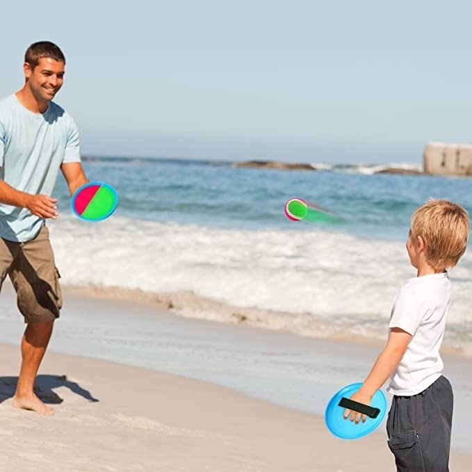 Adult and child play catch