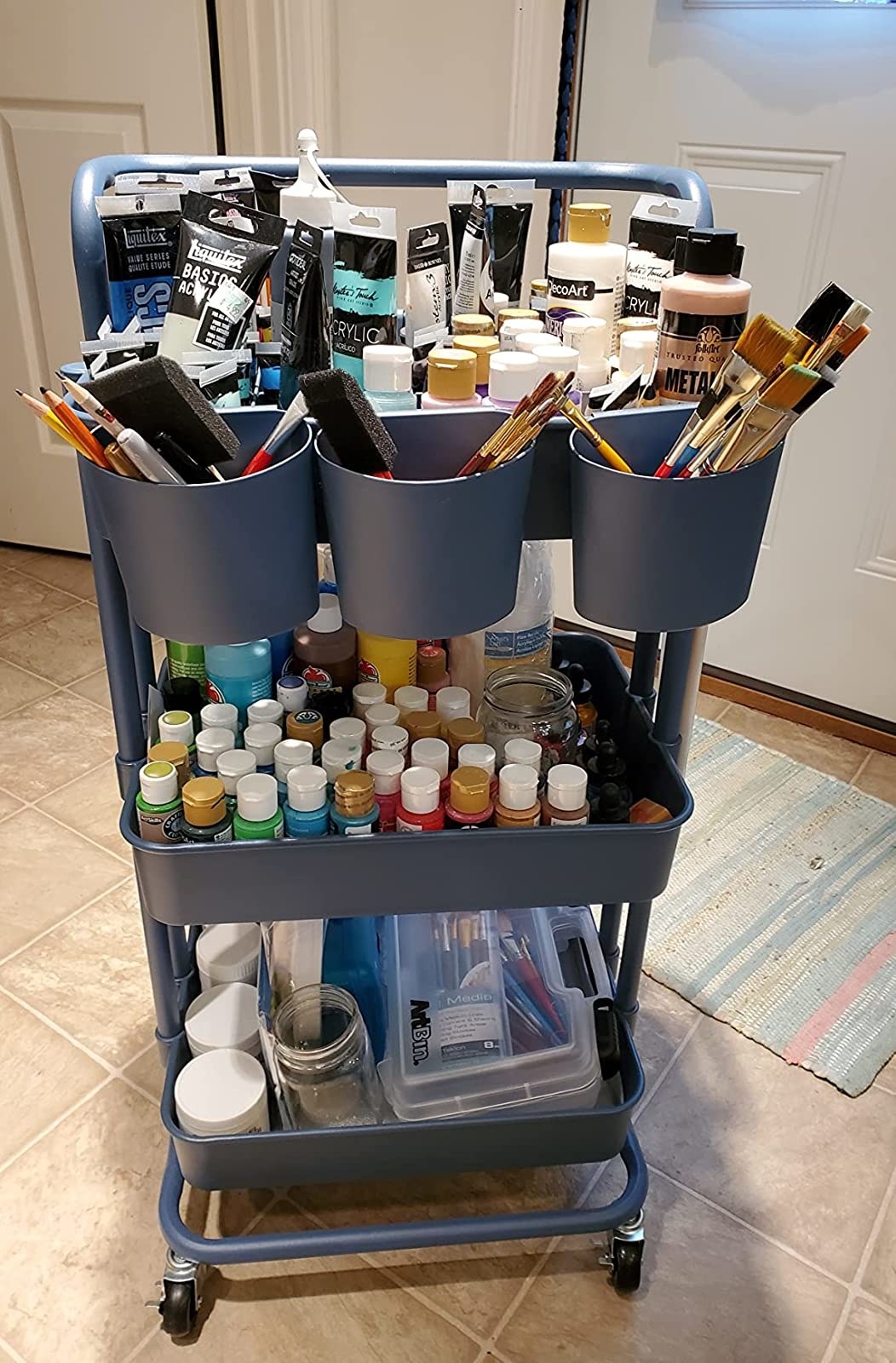 reviewer&#x27;s rolling cart in navy blue with lots of craft supplies on it