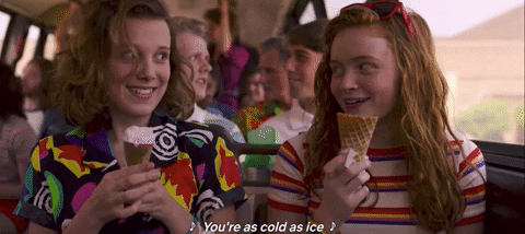 Max and Eleven giving each other a high five and laughing