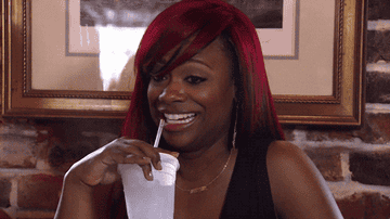 Kandi Burruss sipping her drink