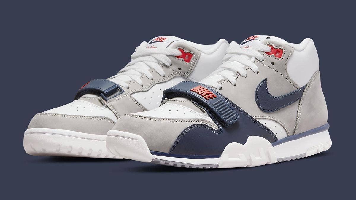 The original 'Midnight Navy' colorway of the Nike Air Trainer 1 is returning in July 2022. Click here for a detailed look at the shoe and the release info.
