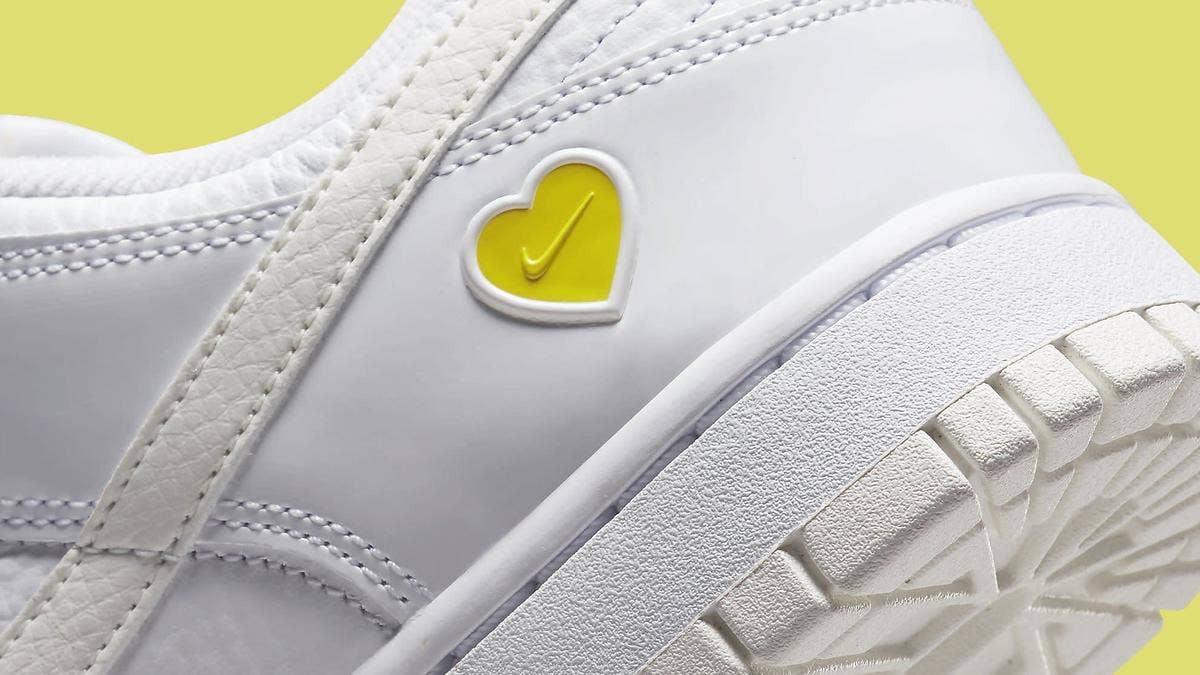 The 'Valentine's Day' Nike Dunk Low for women features a simple and easily wearable white and yellow colorway that communicates the idea that love is simple.