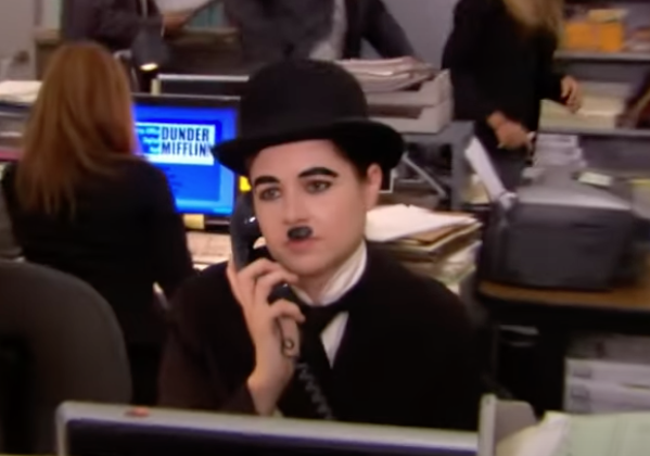A person dressed like Charlie Chaplin