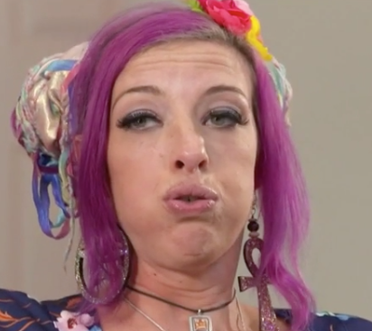 Closeup of a woman making a cringey face