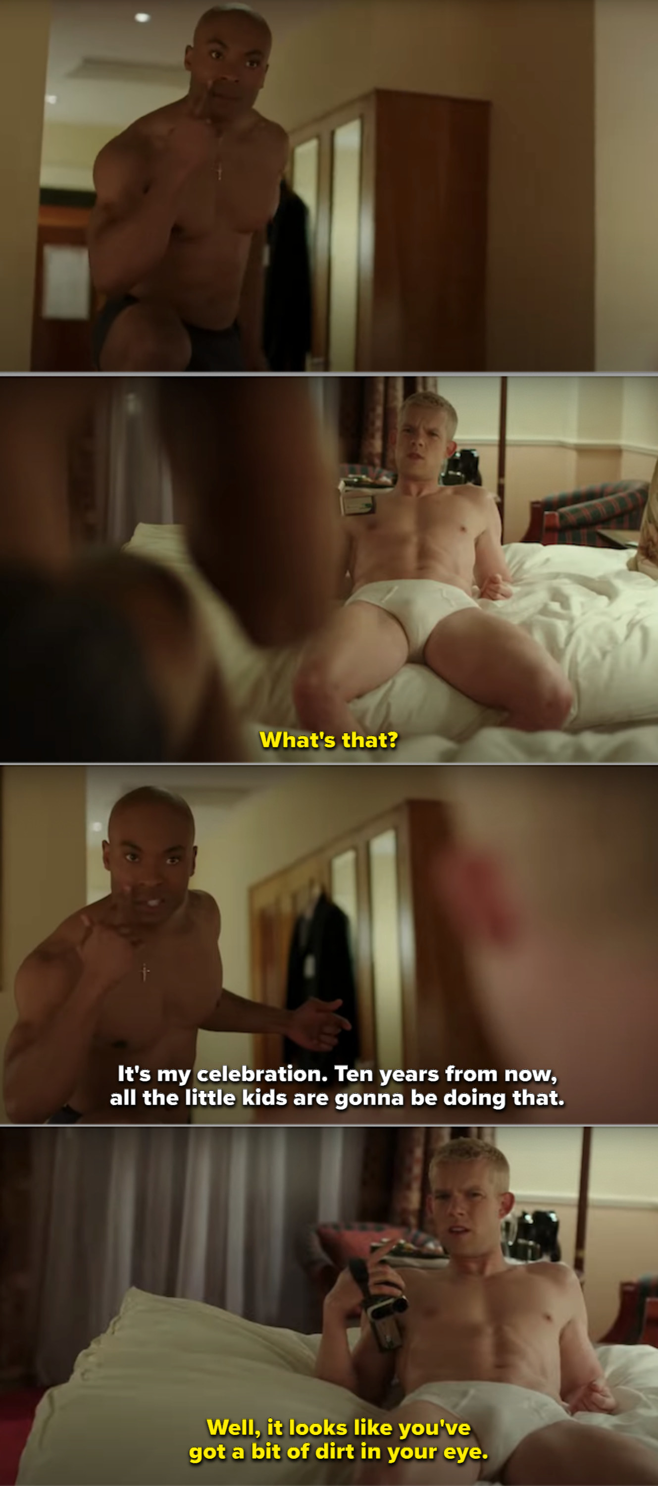 Russell and Arinzé in their hotel room, shirtless