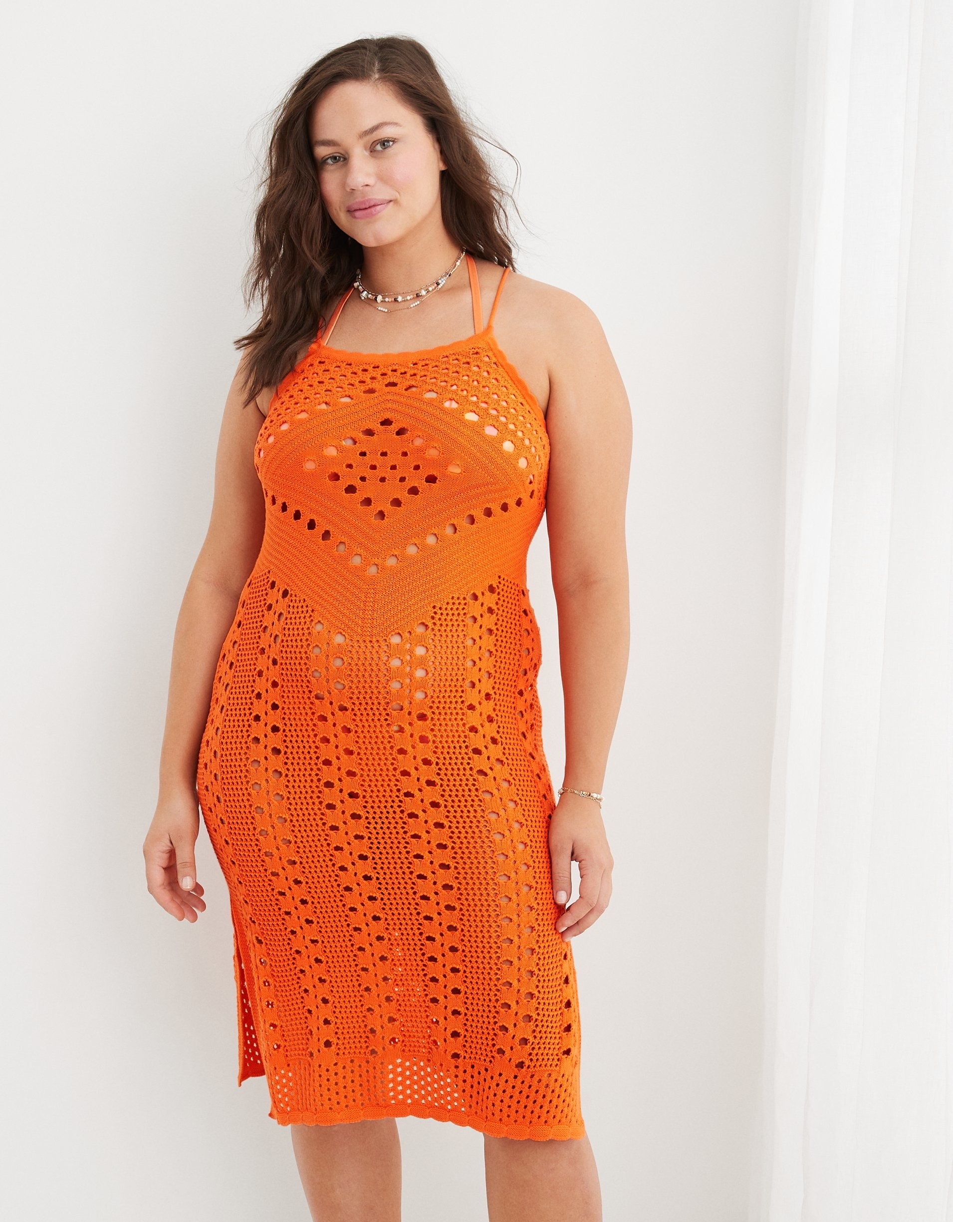model in orange crocheted midi tank dress