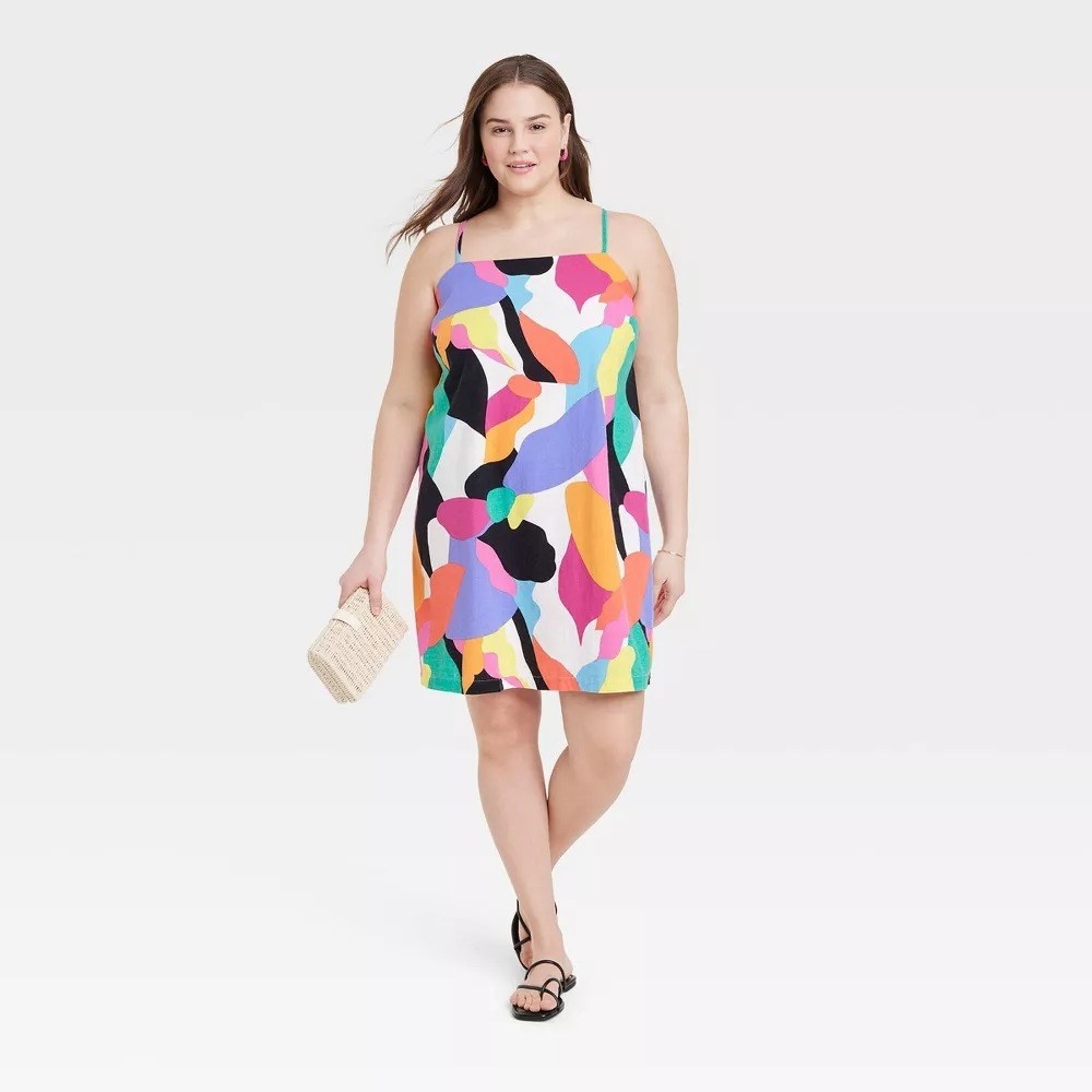 A model in the short multi colored dress