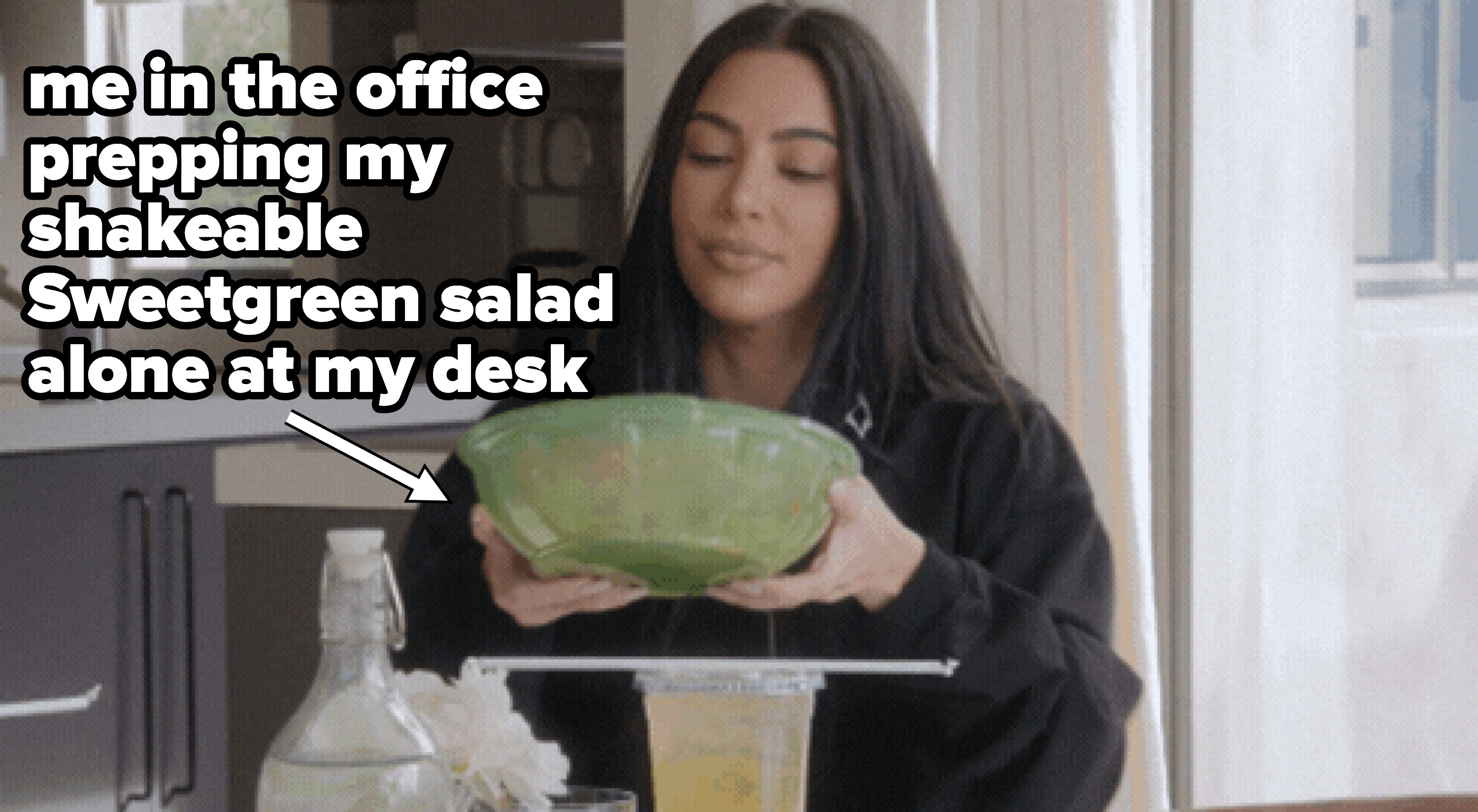 Kim Kardashian shaking a salad