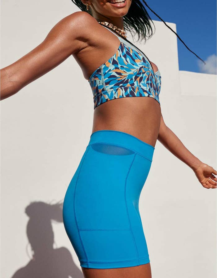 bright blue bike shorts with pockets and a tiny mesh cutout on the sides