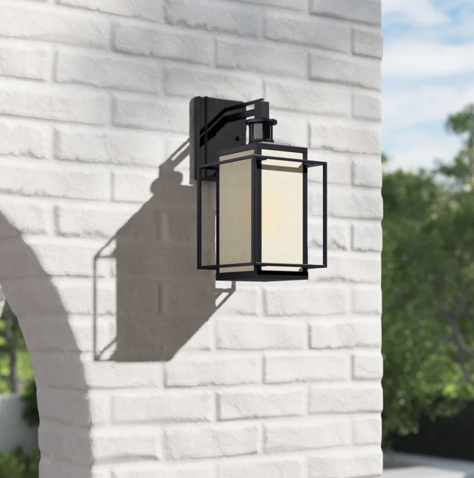 The lantern hanging from a brick wall