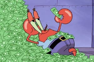 mr krabs from spongebob lays in a pile of money