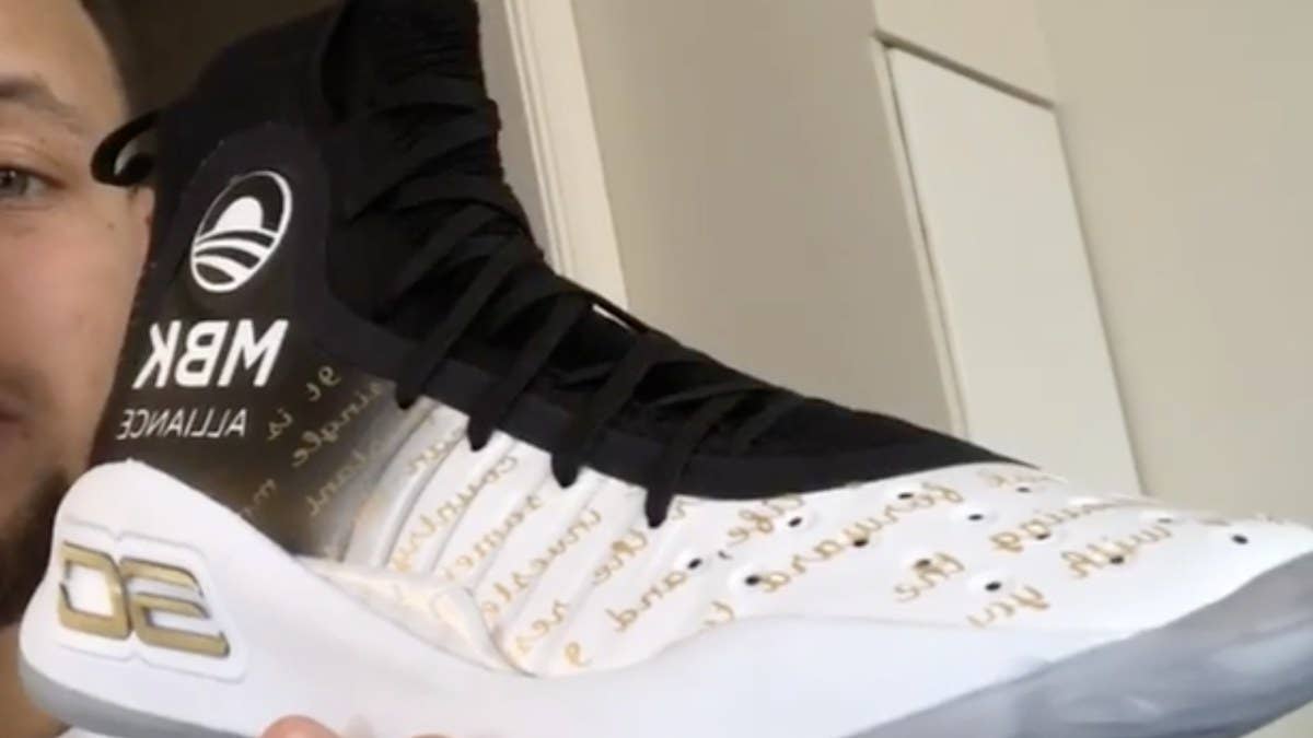 Steph Curry previews a special custom pair of his Under Armour Curry 4 honoring the MBK Alliance that he will wear during the Golden State Warriors-Washington Wizards game in Washington D.C.
