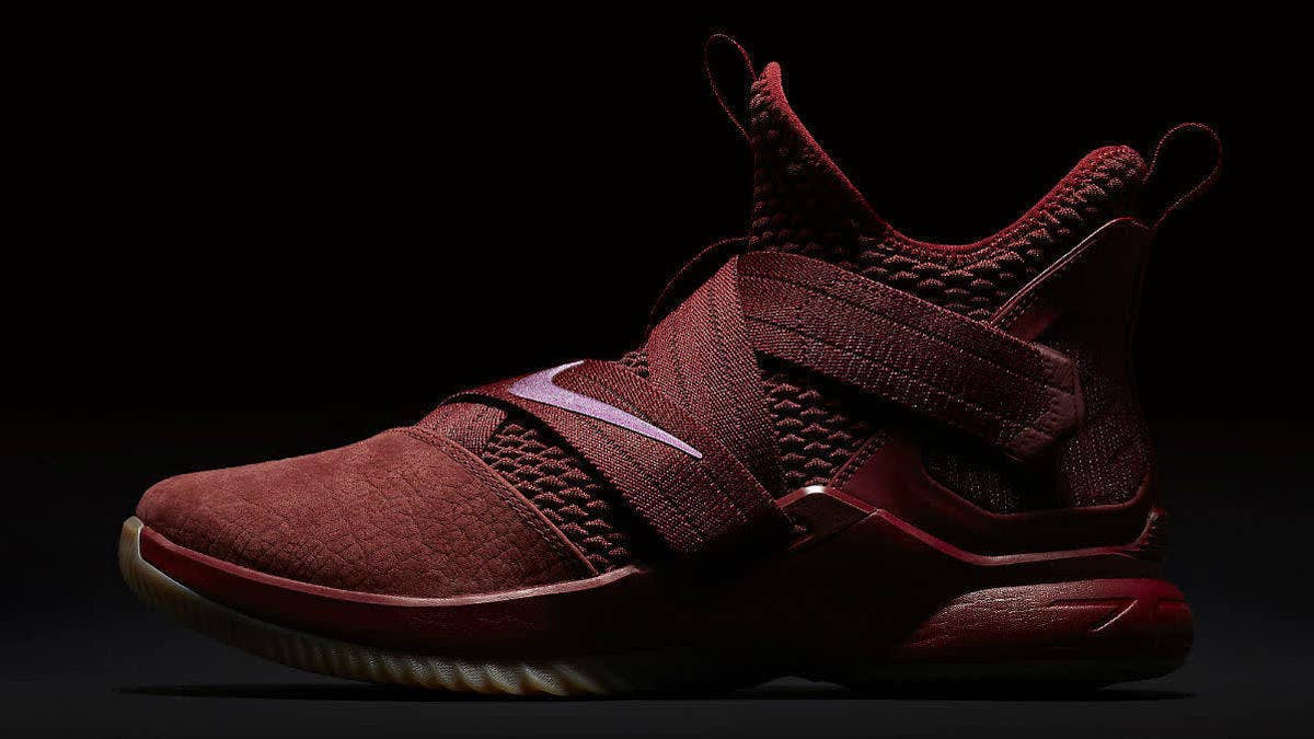 With LeBron James' free agency looming, the Nike LeBron Soldier 12 surfaces in a Cavs-inspired colorway that pairs a burgundy upper with a gum rubber outsole.