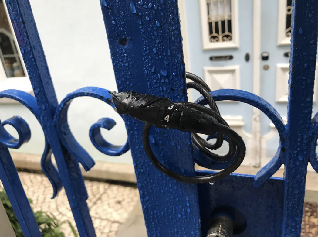 a bike lock that has a one digit password on a metal door