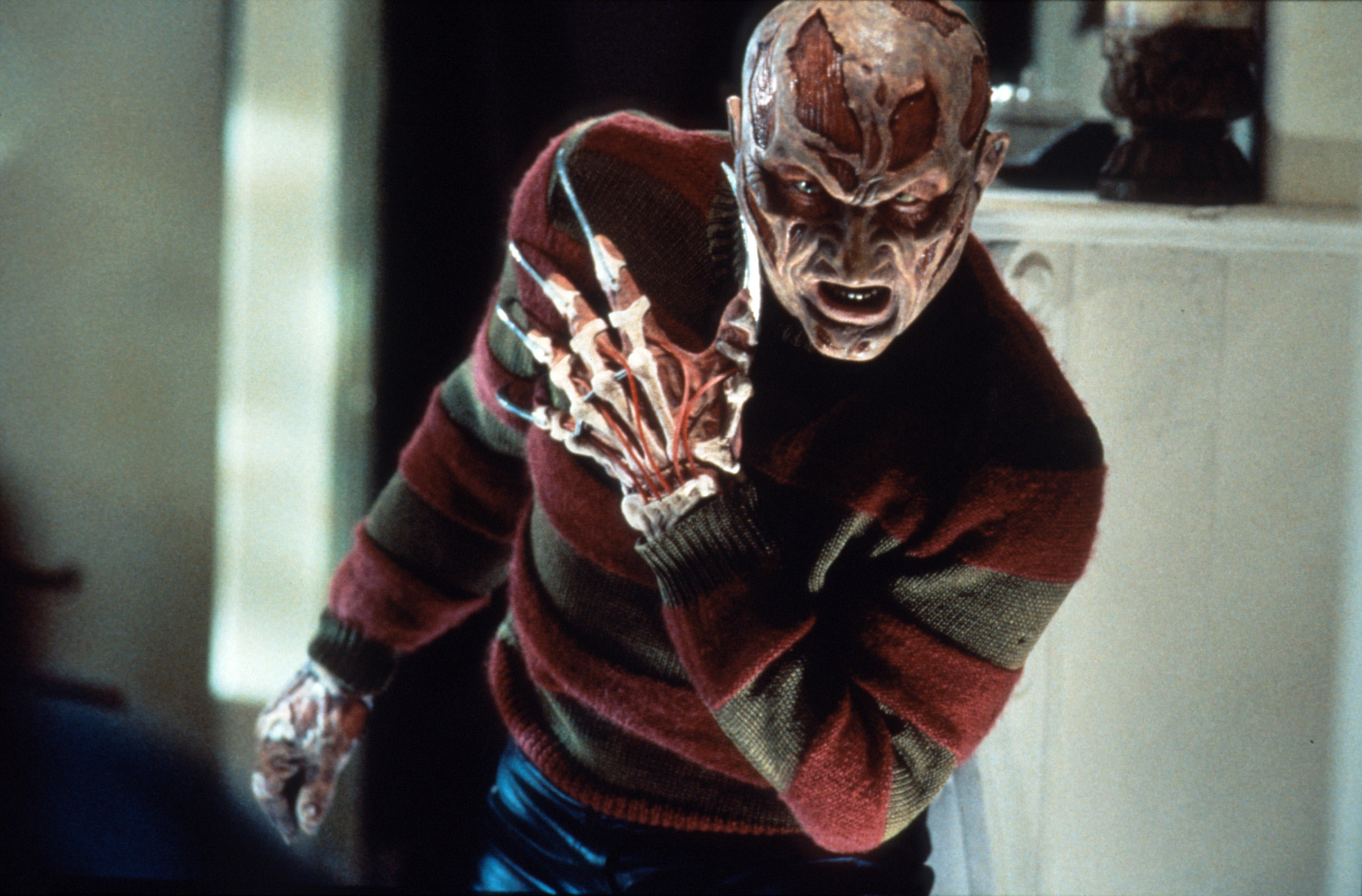 A demonic variation of Freddy Krueger poses menacingly.