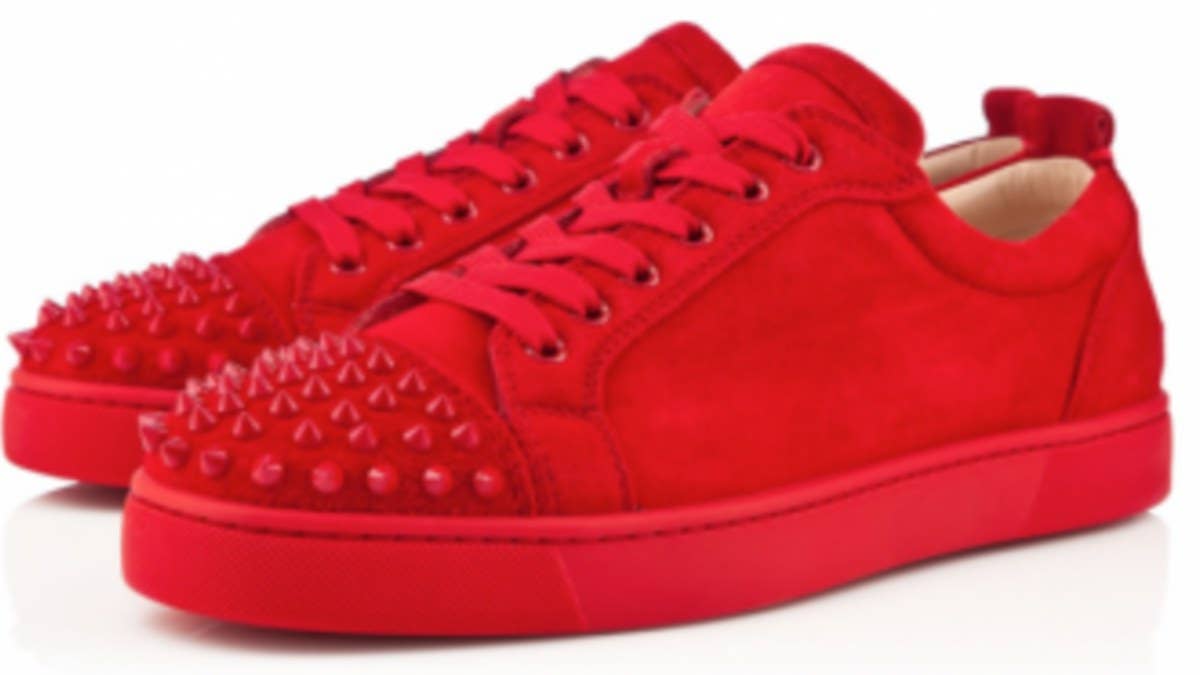 French luxury footwear designer Christian Louboutin presents the new Louis Junior Spikes flat, available now in a bold, red suede colorway.