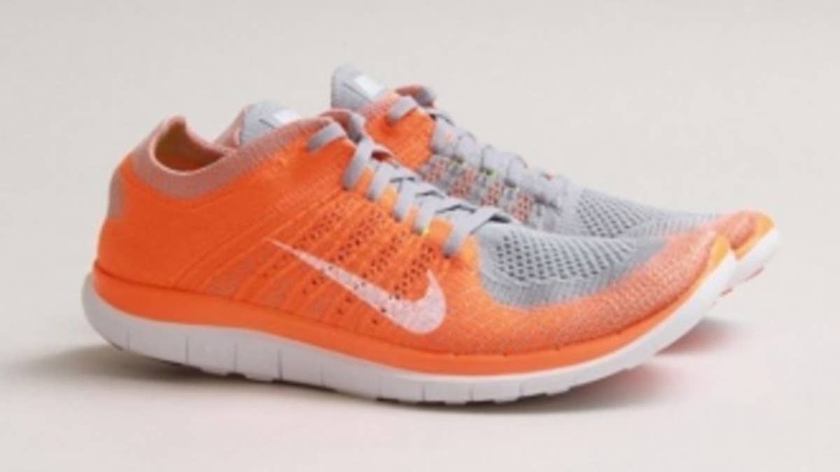 One of Nike's latest offerings in the world of running footwear is introduced in an appealing Wolf Grey/Total Orange color scheme.