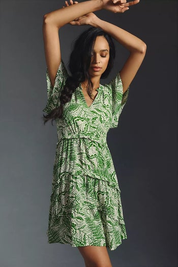 model wearing a green and white patterned dress