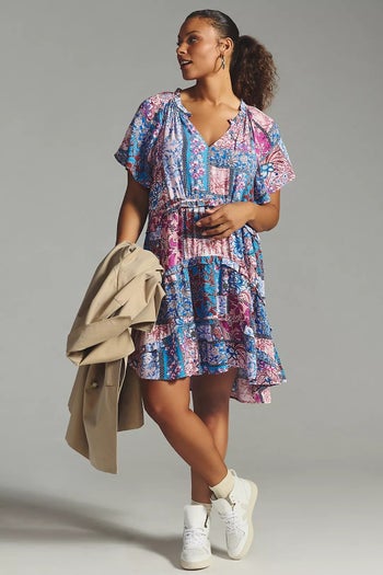 model wearing the dress in blue and pink