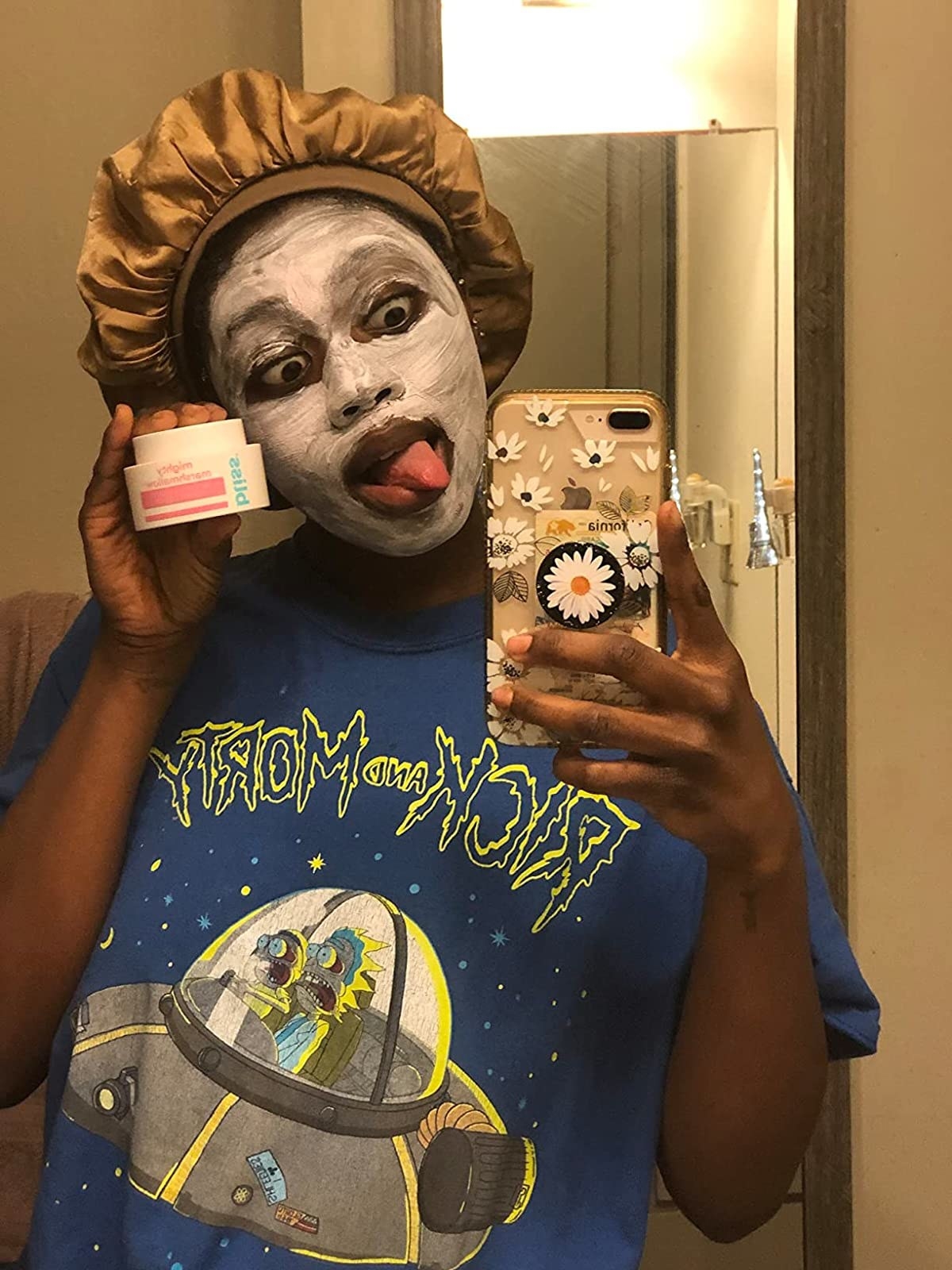 A reviewer taking a selfie with a mask on them