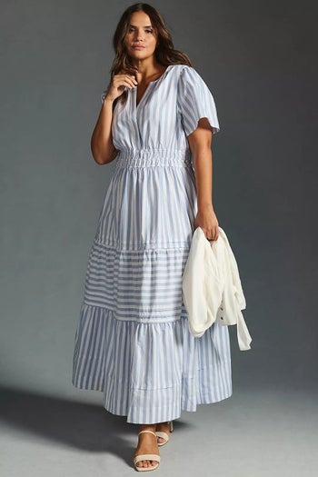 model wearing the dress in blue and white stripes