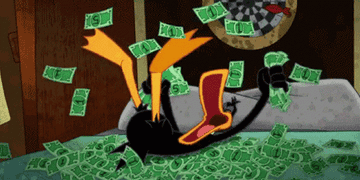 A duck playing in a bunch of cash