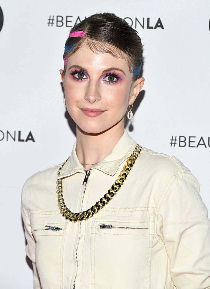 A close-up of Hayley on the red carpet wearing a denim jacket and a gold chain