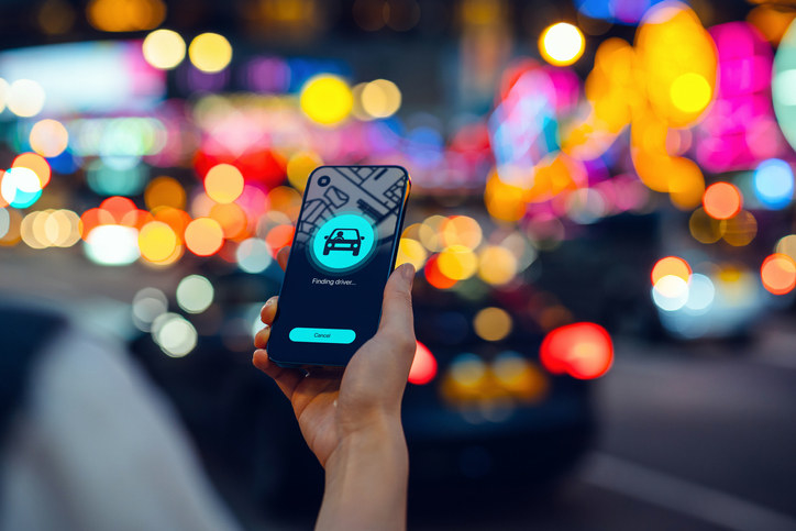 A phone with a ride-sharing app opened