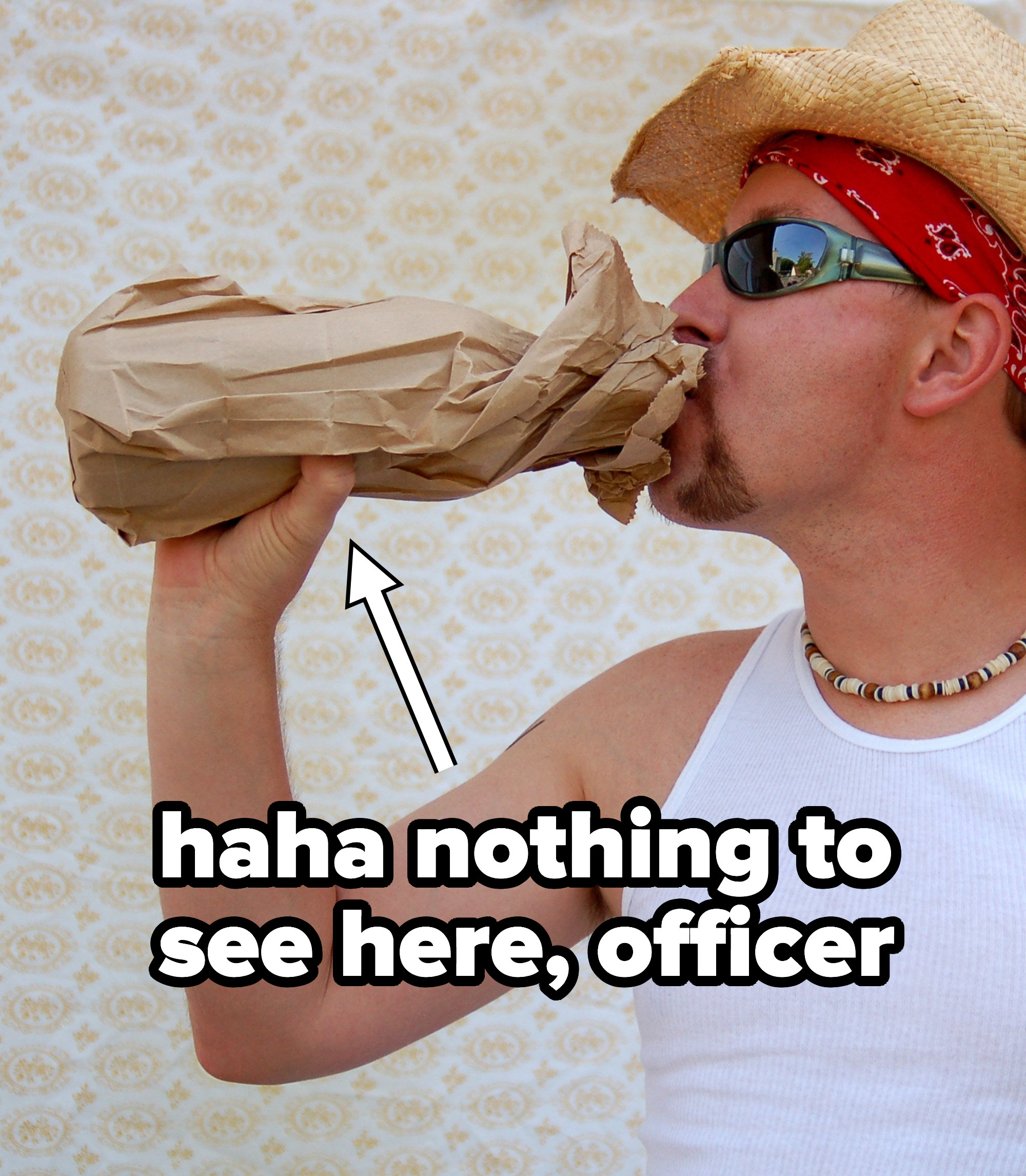 Someone drinking alcohol out of a paper bag