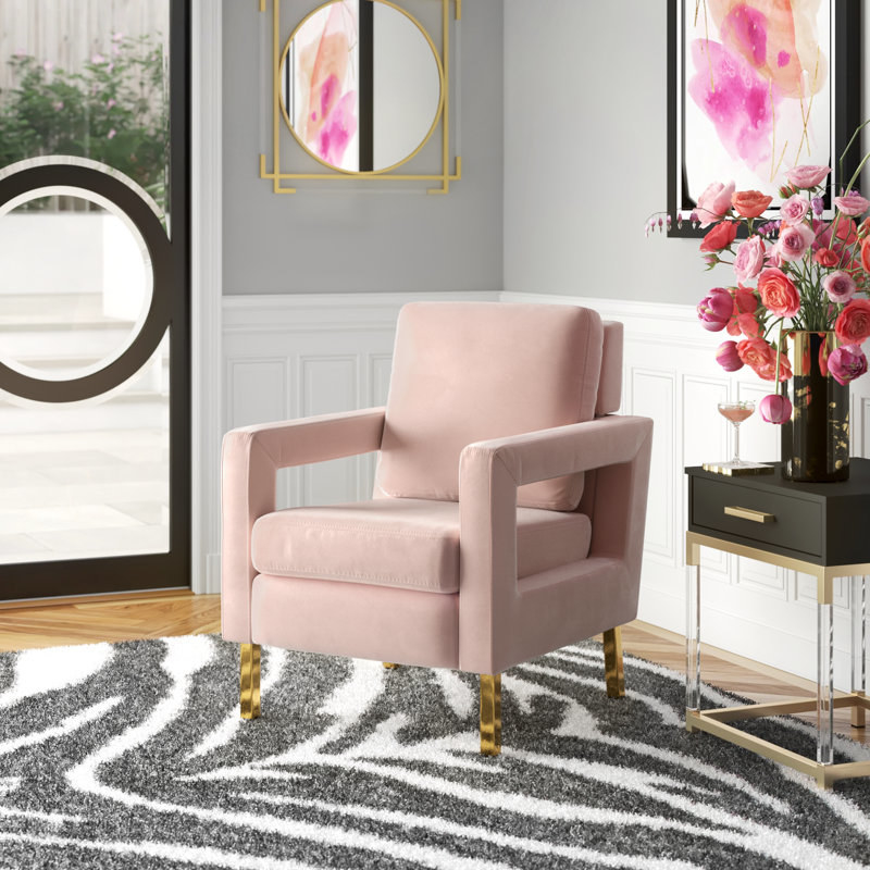 pink velvet chair with gold legs in a glam entryway