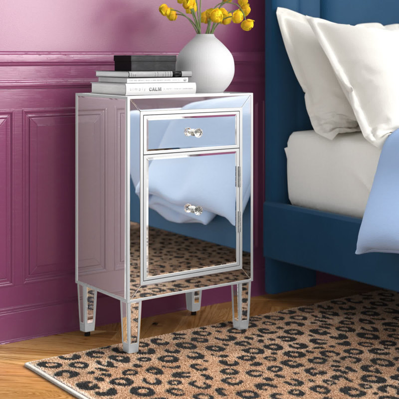 a mirrored nightstand with two drawers