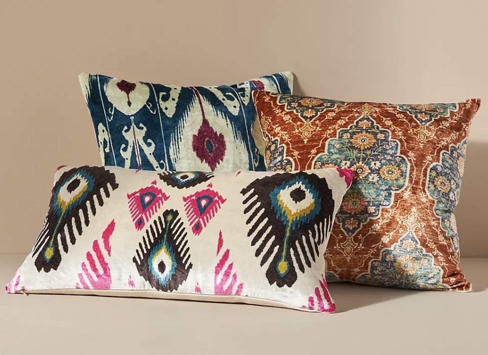 Three of the throw pillows in different patterns