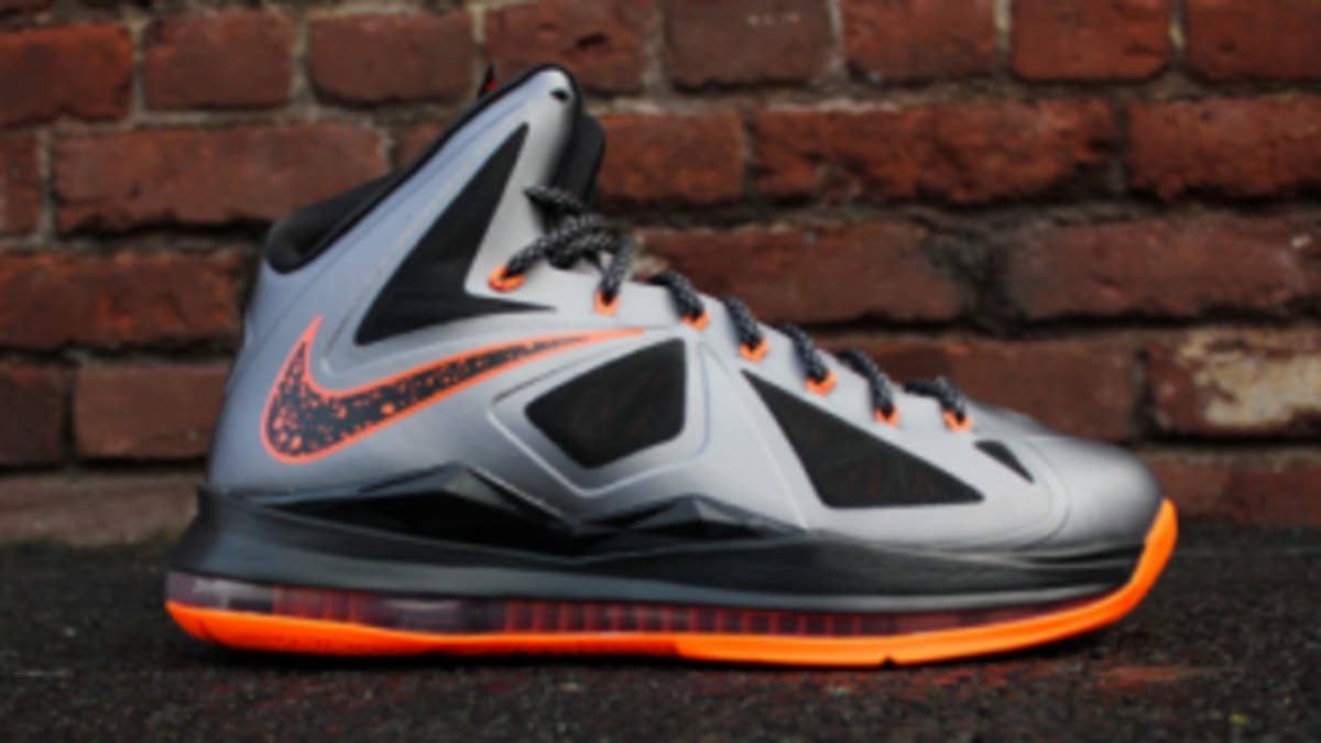 The stream of new LeBron X offerings will continue this weekend with the release of the Charcoal / Total Orange / Black colorway.