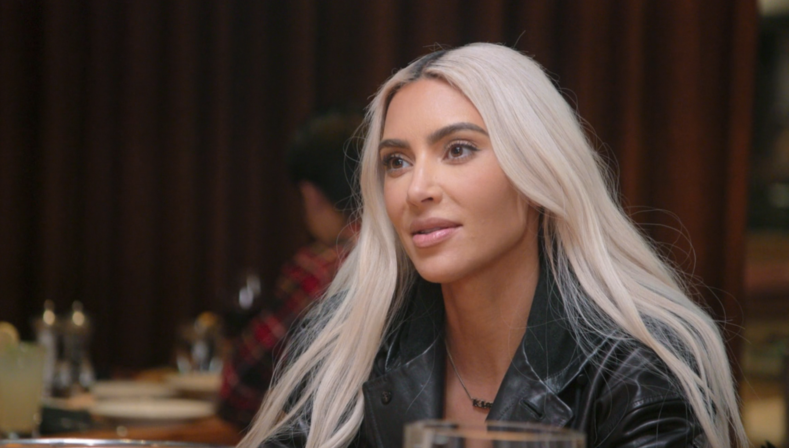 Close-up of Kim at a dining table
