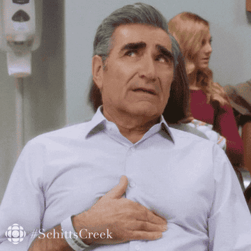 Johnny Rose from &quot;Schitt&#x27;s Creek&quot; rubbing his chest.