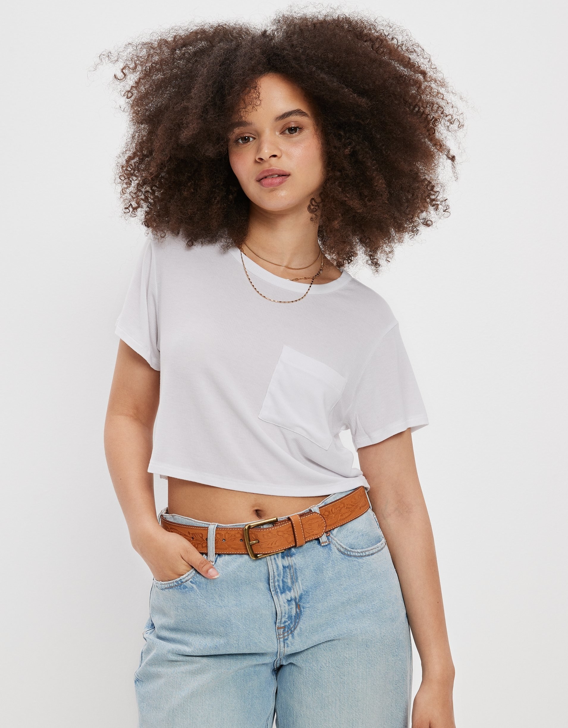 model in a the white cropped pocket tee