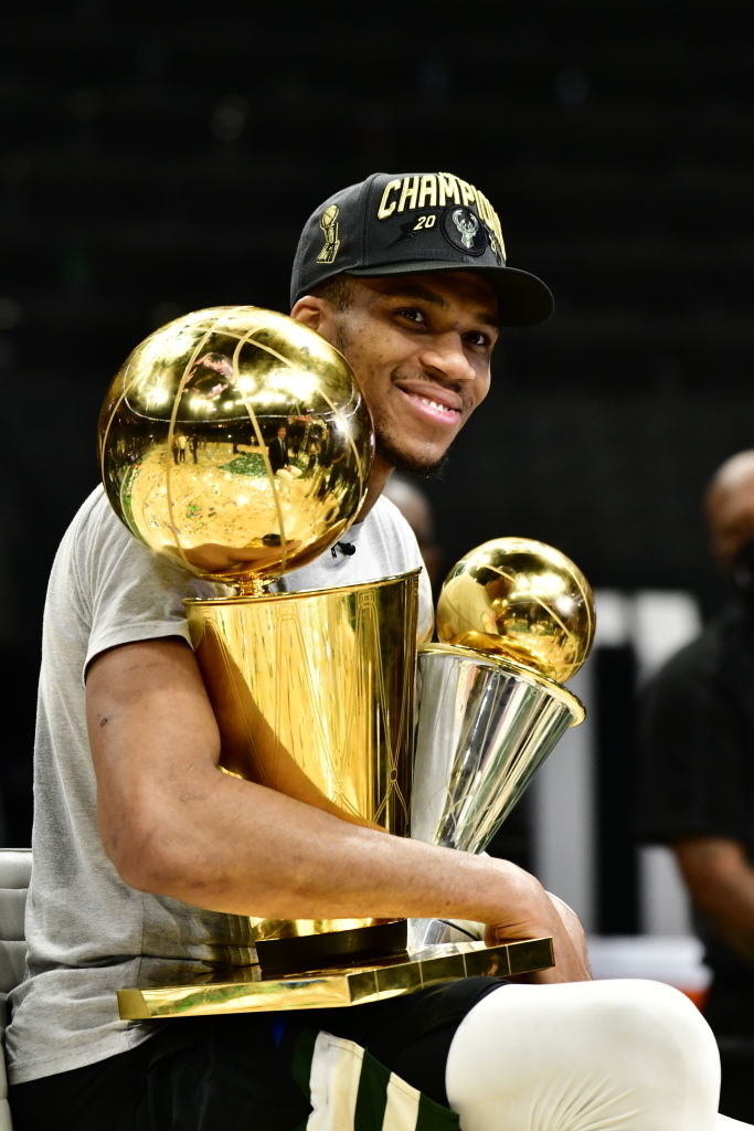 Close-up of Giannis smiling and holding an award