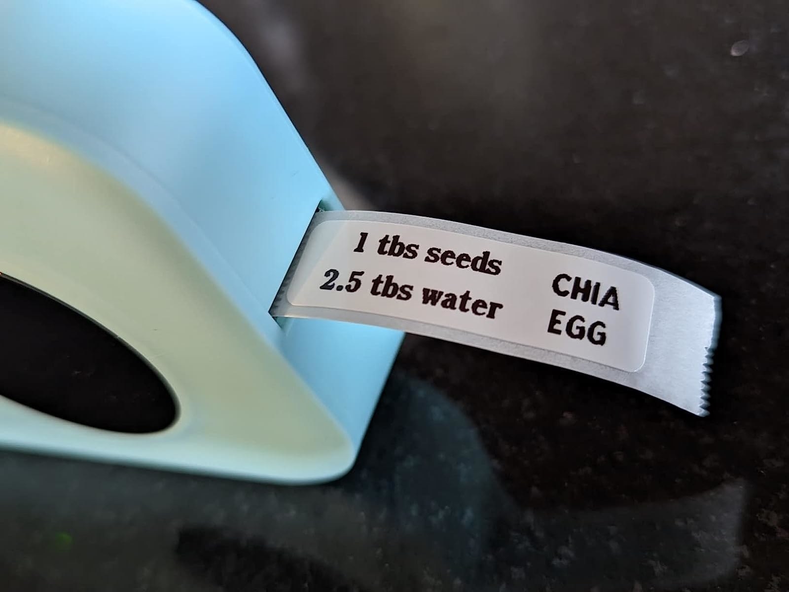 Reviewer image of the blue label maker and small sticker label