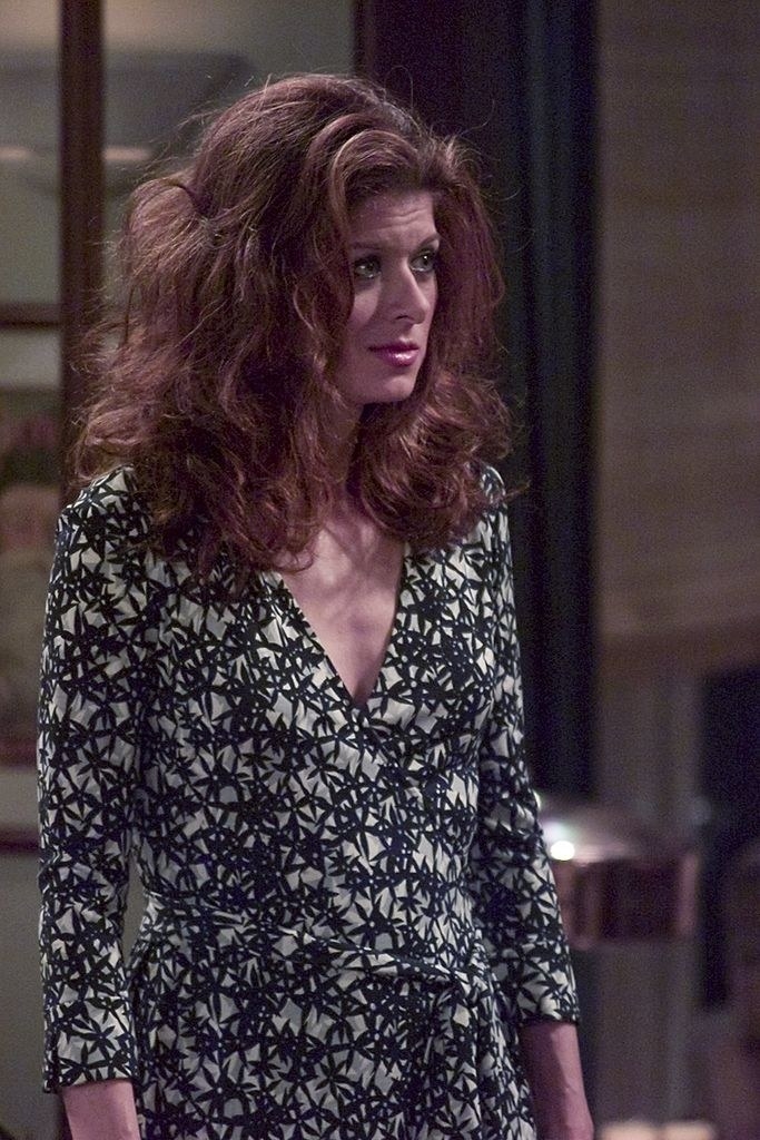 Grace Adler in a printed wrap dress