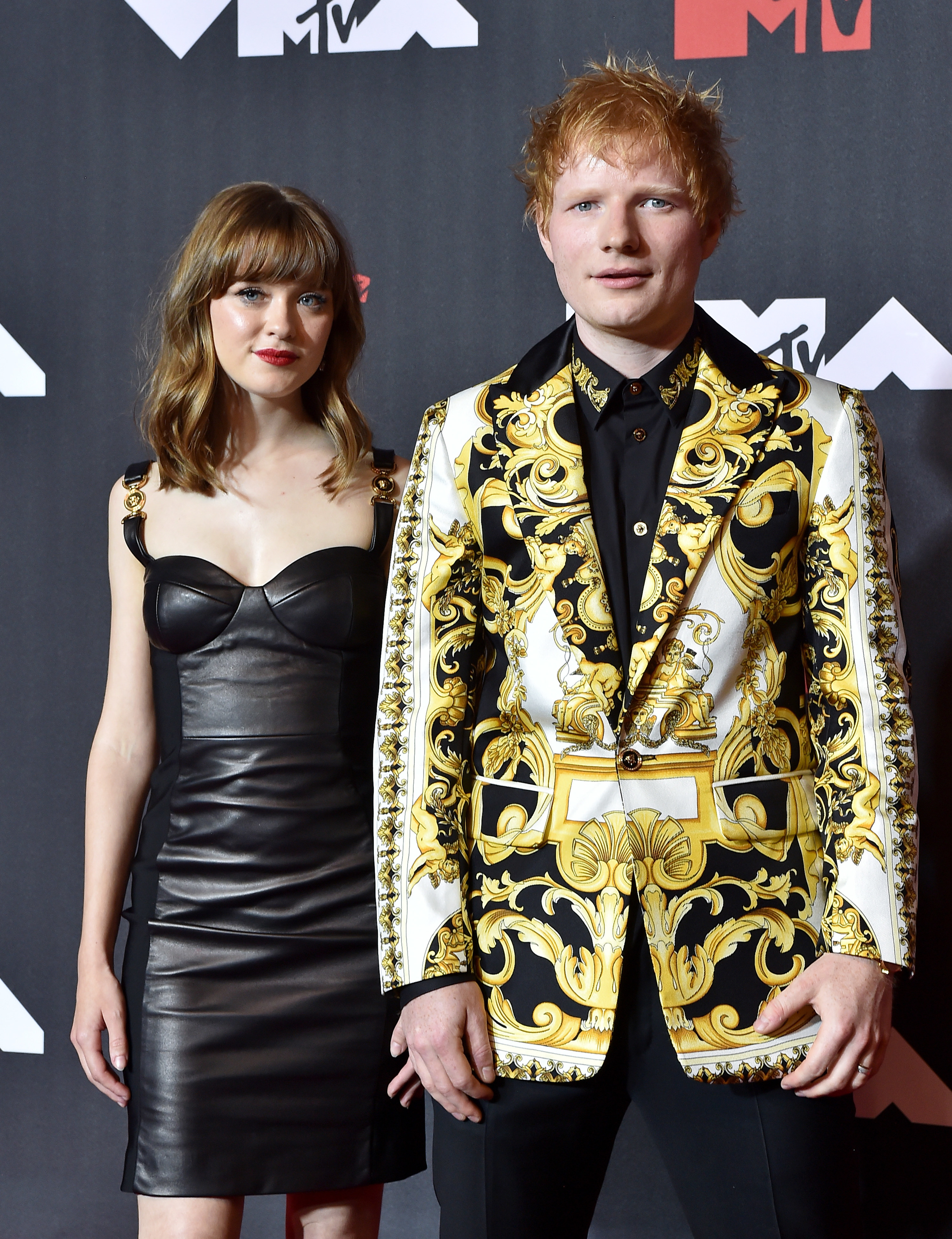 Maisie and Ed standing together