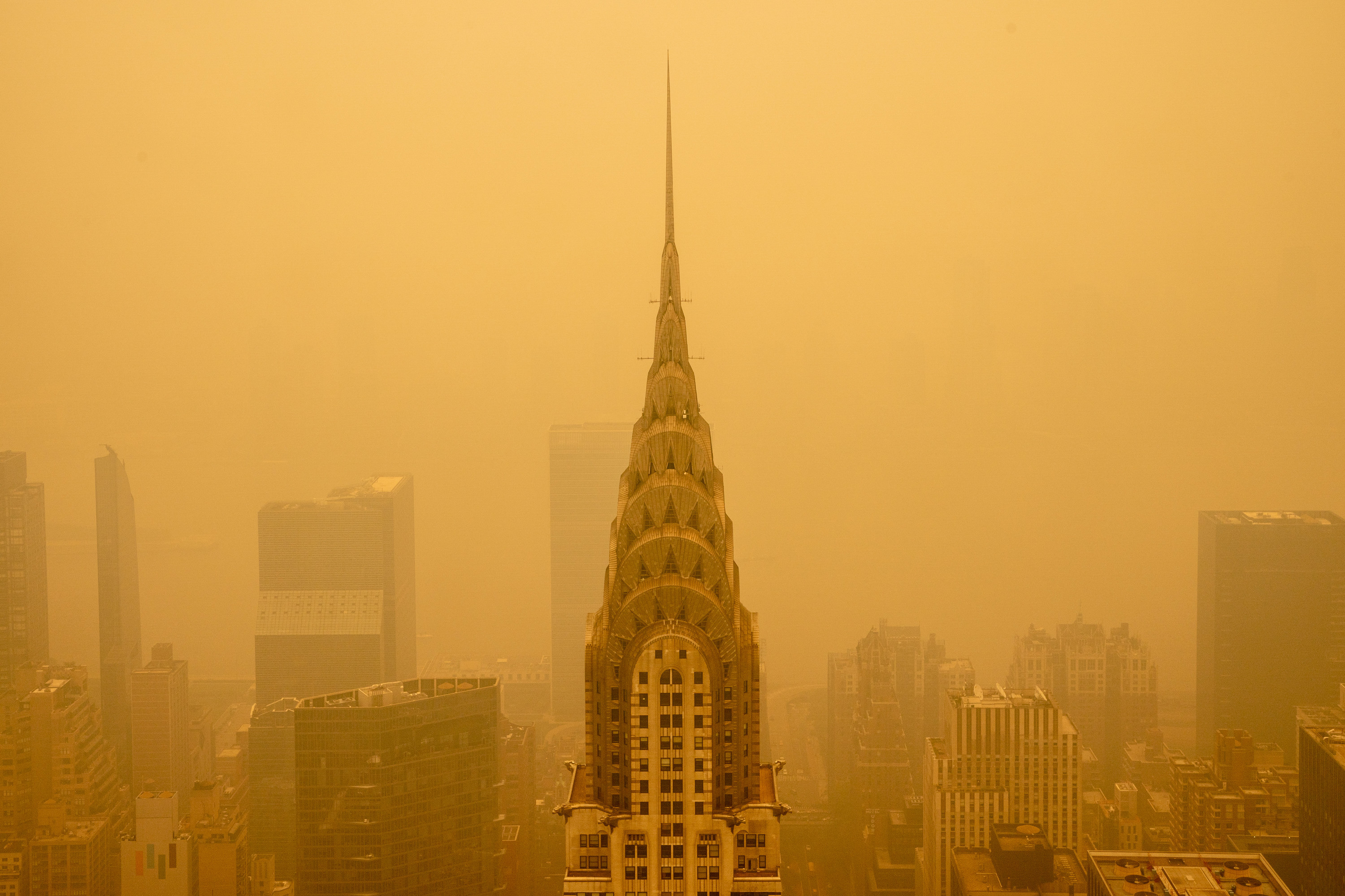 The Chrysler Building in New York City engulfed by orangey haze