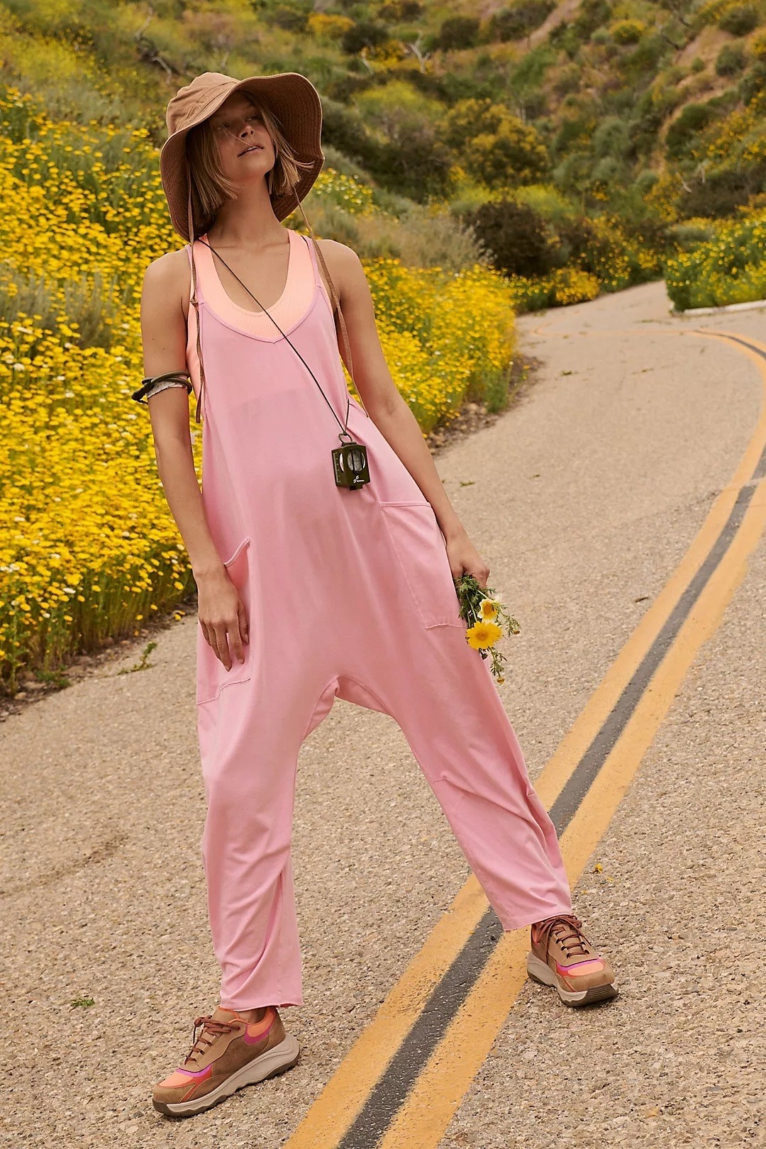 Model wearing pink onesie