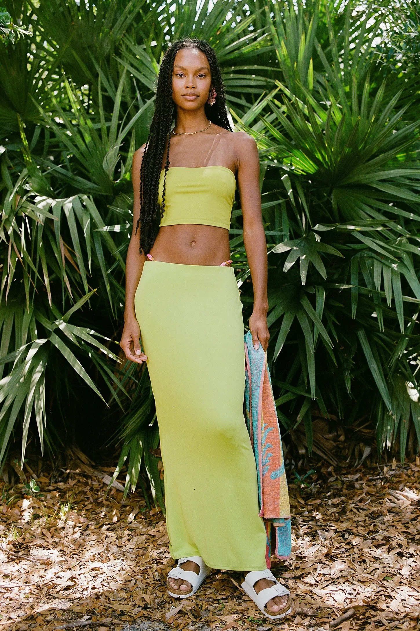 Reviewer wearing long green maxi skirt with matching tube top