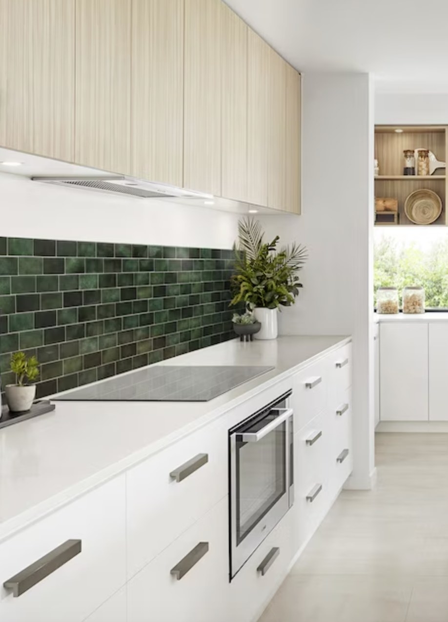 the dark green tile in a white modern kitchen
